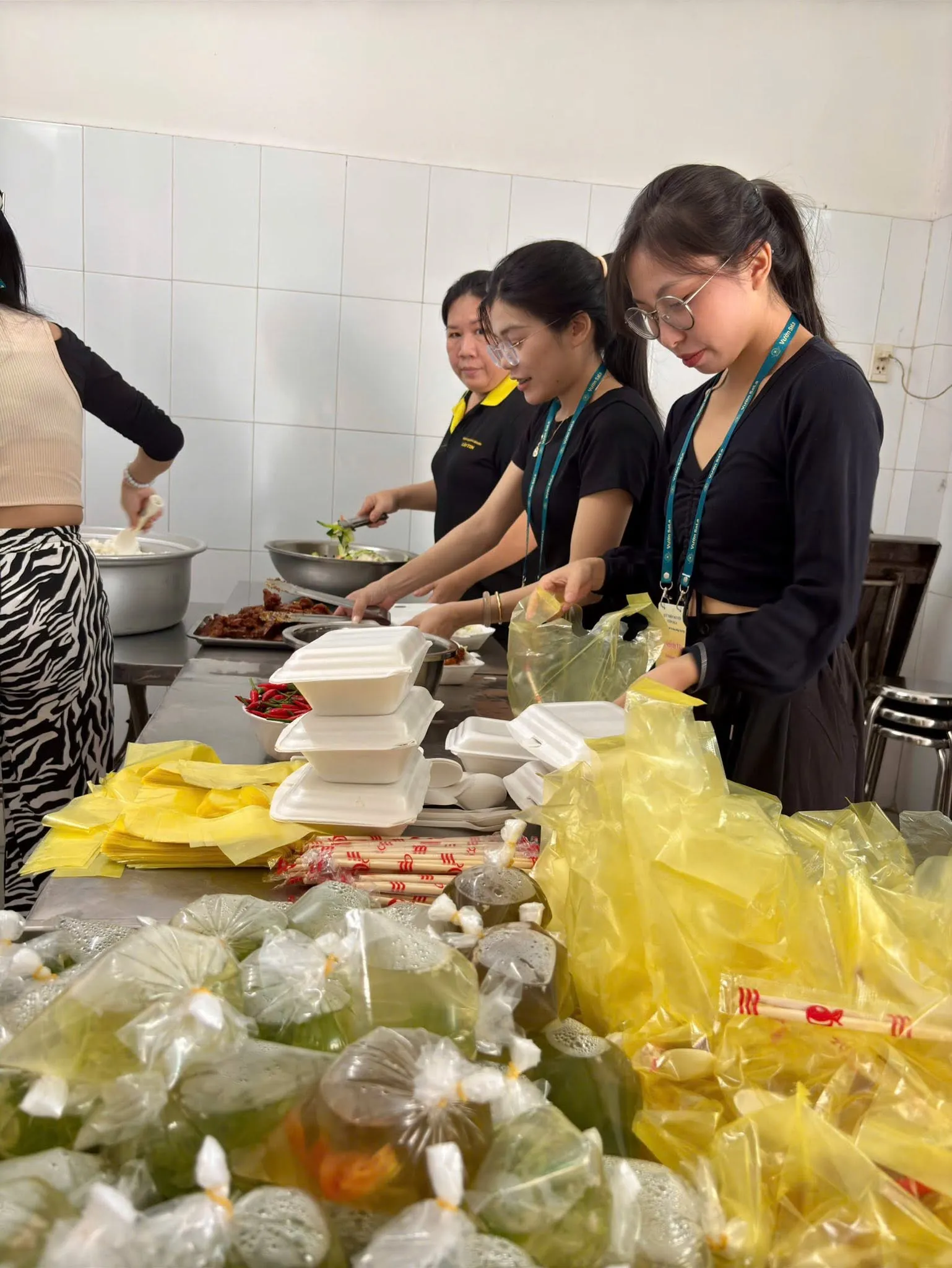 Volunteers packing the meals into bags