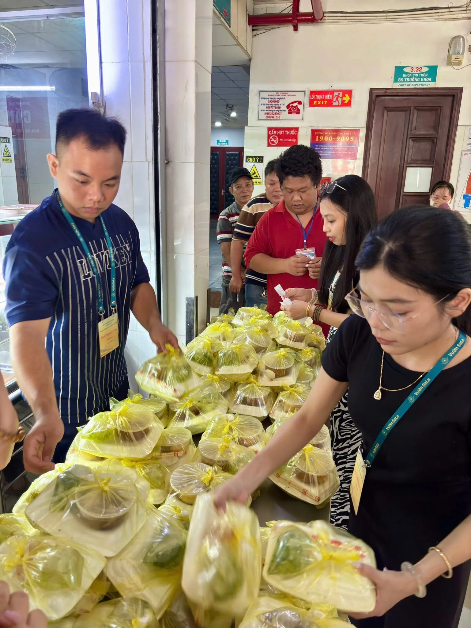 Volunteers arranging the bagged meals on the table