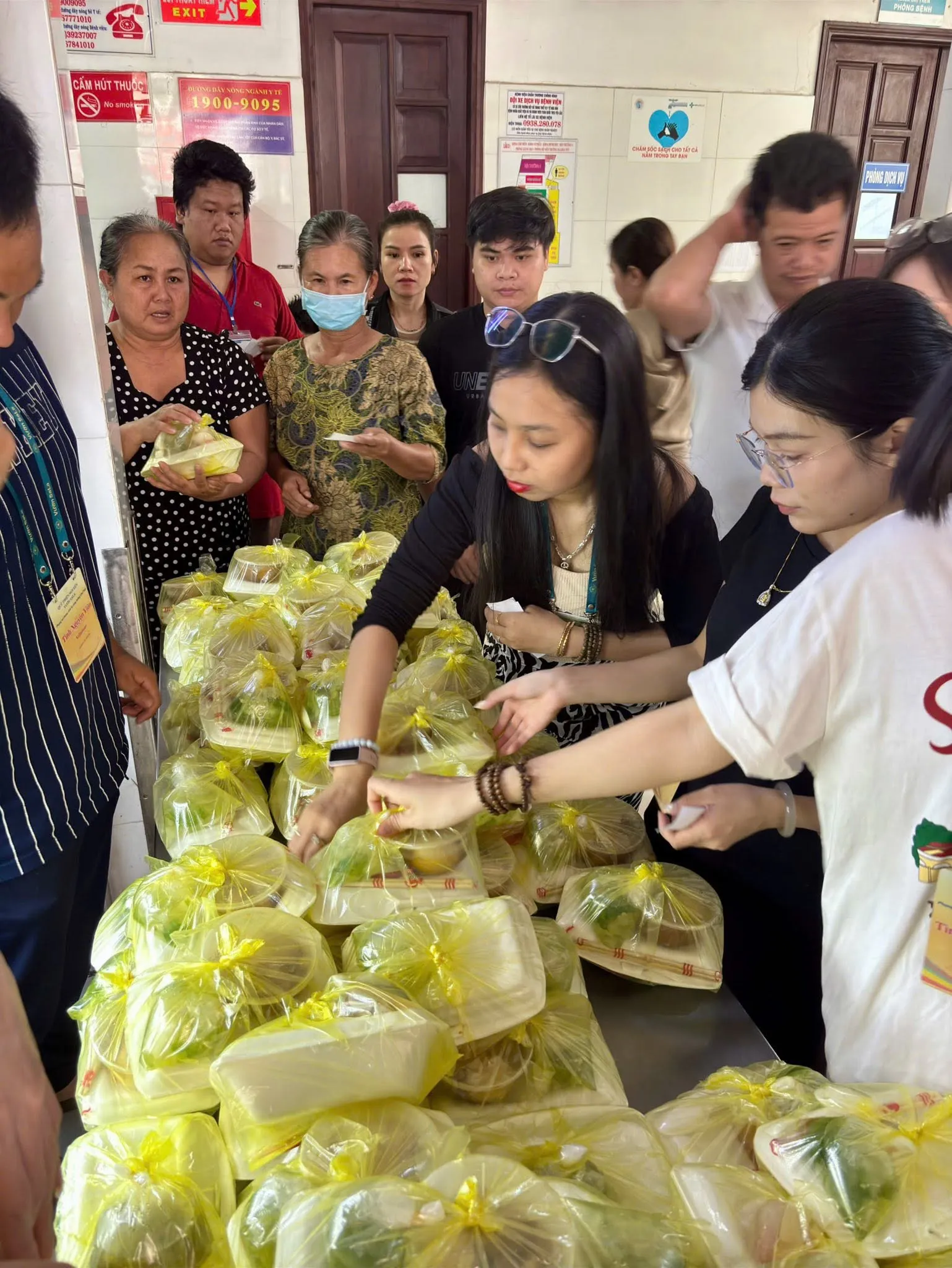 People lining up to receive meals from the volunteers